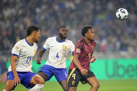 2024–25 UEFA Nations League, France vs Belgium: Belgium's Lois Openda, right, goes to the ball as France's Dayot Upamecano